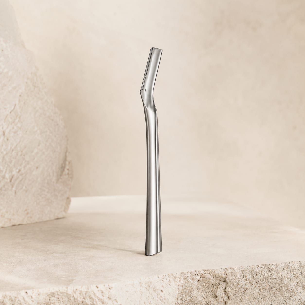Ritual Eight Precision Razor standing upright on stone